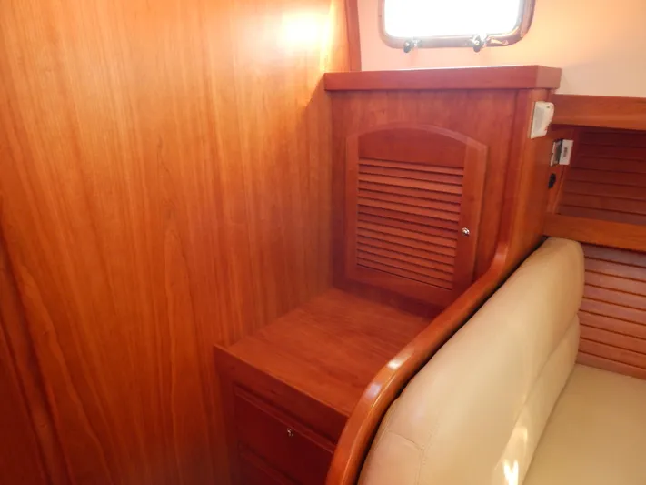  Yacht Photos Pics Interior of 2010 Sabre 40 Sedan with wooden cabinetry and beige seating.