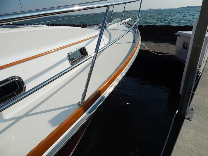  Yacht Photos Pics 2010 Sabre 40 Sedan yacht docked, showcasing sleek design and polished railings.