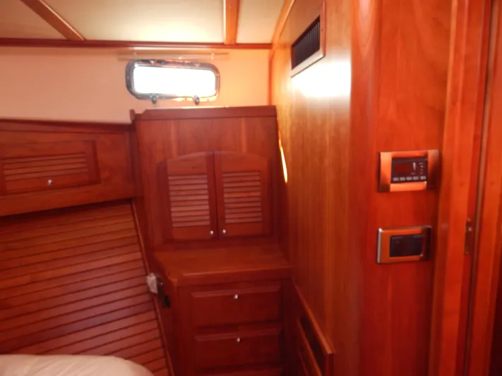  Yacht Photos Pics Interior of 2010 Sabre 40 Sedan yacht with wooden cabinetry and modern controls.