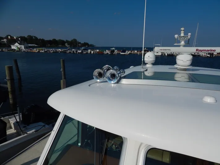 Yacht Photos Pics 2010 Sabre 40 Sedan yacht docked, featuring radar and horn on the roof.
