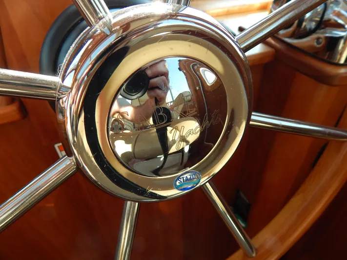  Yacht Photos Pics Close-up of a polished steering wheel on a 2010 Sabre 40 Sedan yacht.