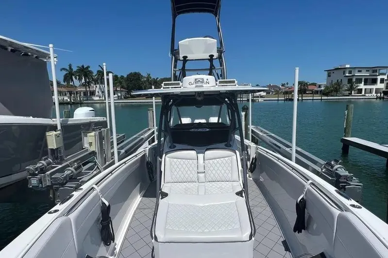  Yacht Photos Pics 2020 Nor-Tech 390 boat docked in a marina, featuring sleek design and modern amenities.