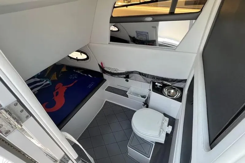  Yacht Photos Pics 2020 Nor-Tech 390 interior cabin with bed, toilet, and storage.