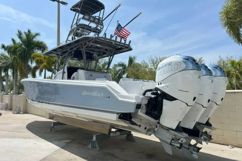  Yacht Photos Pics 2020 Nor-Tech 390 boat with triple Mercury 400R engines, displayed outdoors.