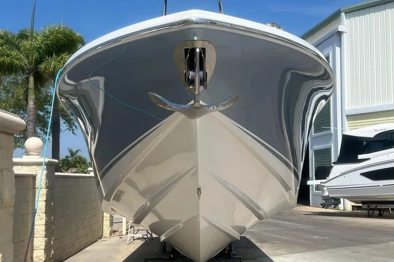  Yacht Photos Pics 2020 Nor-Tech 390 boat, sleek design, docked outdoors, palm trees in background.