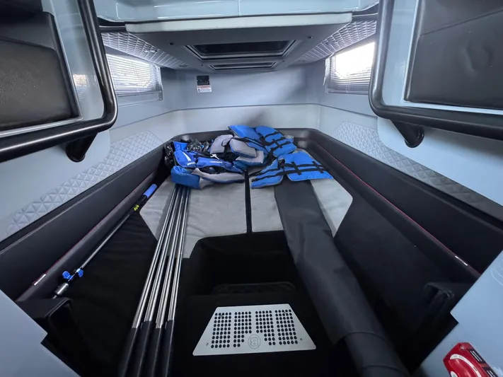  Yacht Photos Pics 2022 Axopar Brabus Shadow 900 XC cabin interior with storage and equipment.