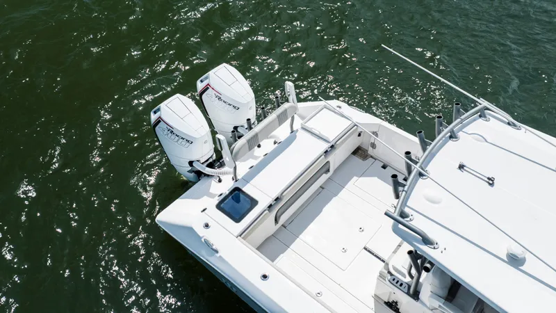  Yacht Photos Pics 2024 Solace 32 CS boat with dual outboard engines on water.