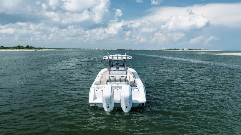 Yacht Photos Pics 2024 Solace 32 CS boat cruising on open water under a cloudy sky.