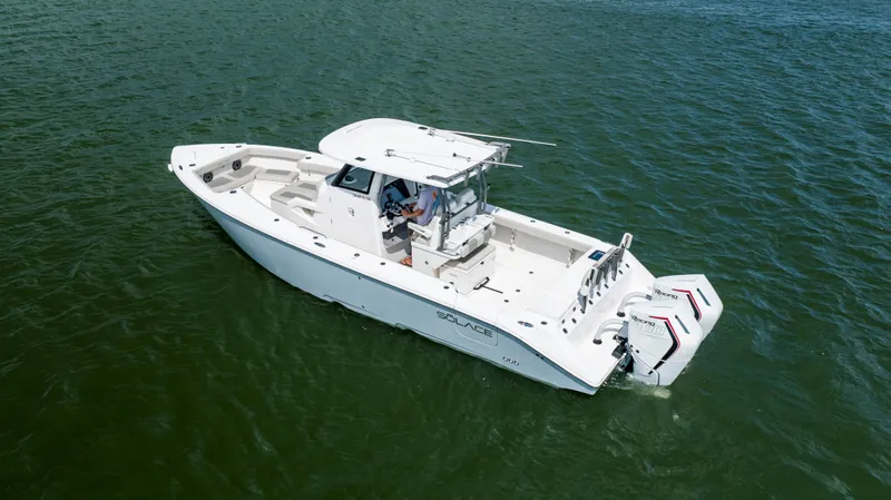  Yacht Photos Pics 2024 Solace 32 CS boat cruising on open water, showcasing sleek design and twin engines.
