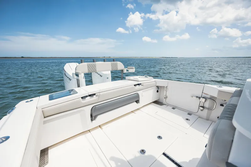  Yacht Photos Pics 2024 Solace 32 CS boat deck with ocean view under blue sky.
