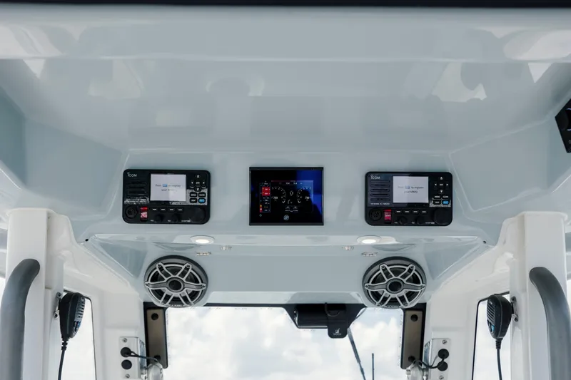  Yacht Photos Pics 2024 Solace 32 CS boat dashboard with modern controls and speakers.