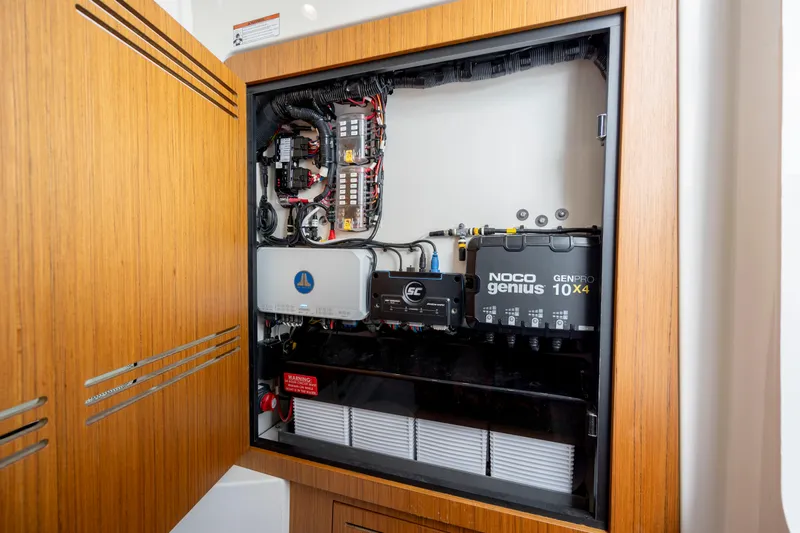  Yacht Photos Pics Electrical panel inside 2024 Solace 32 CS boat, featuring NOCO Genius GENPRO 10X4 charger.