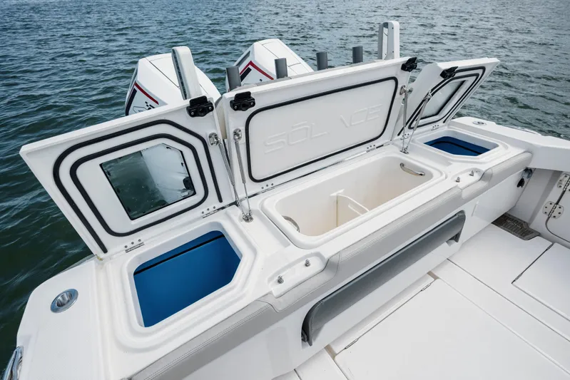  Yacht Photos Pics 2024 Solace 32 CS boat with open storage compartments on the deck.