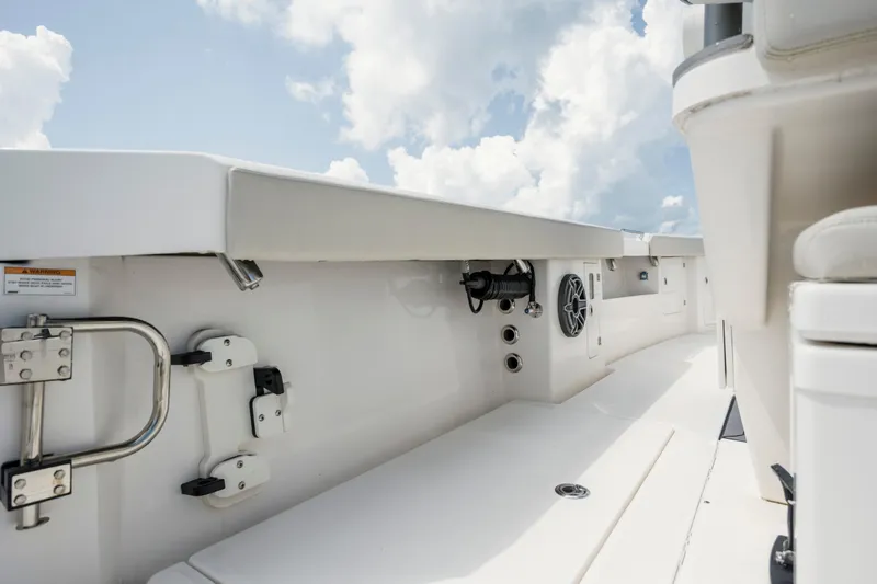  Yacht Photos Pics 2024 Solace 32 CS boat interior with sleek design and modern features under a cloudy sky.