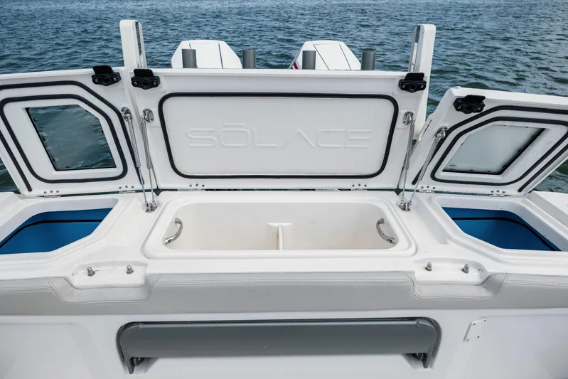  Yacht Photos Pics 2024 Solace 32 CS boat with open storage compartments on the deck.