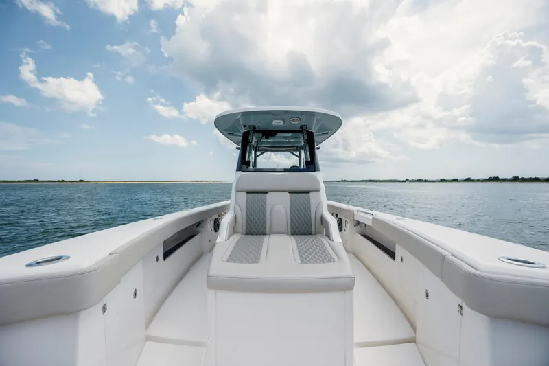  Yacht Photos Pics 2024 Solace 32 CS boat on open water under cloudy sky.