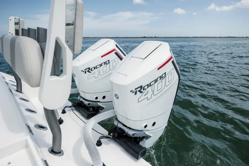  Yacht Photos Pics 2024 Solace 32 CS boat with dual Racing 400 outboard engines on open water.