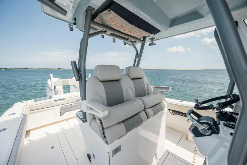 Yacht Photos Pics 2024 Solace 32 CS boat interior with dual seats and ocean view.