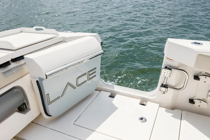  Yacht Photos Pics 2024 Solace 32 CS boat deck with water view, featuring sleek design elements.