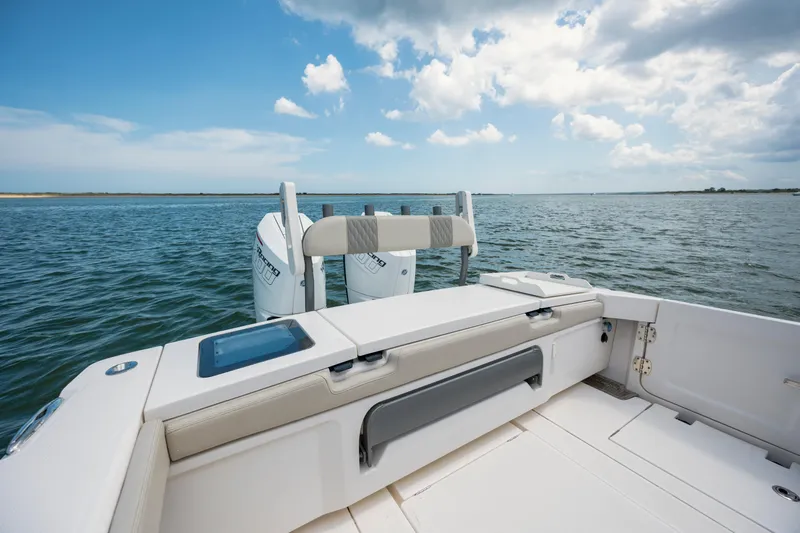  Yacht Photos Pics 2024 Solace 32 CS boat deck with twin engines on a sunny day.