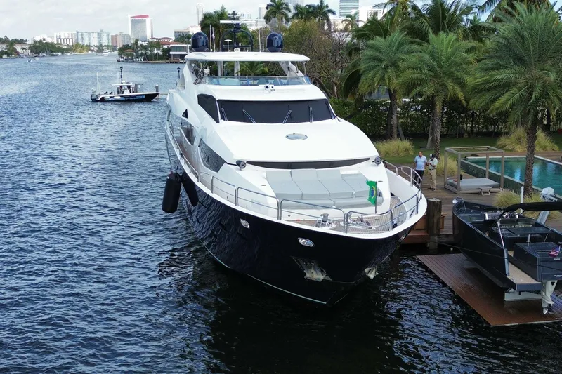 Blue Yacht Photos Pics Luxurious 2011 Azimut 112 yacht docked by palm trees and waterfront.