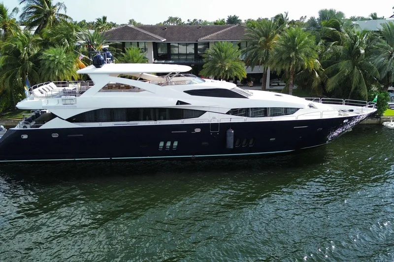 Blue Yacht Photos Pics Luxurious 2011 Azimut 112 yacht docked by tropical waterfront estate.