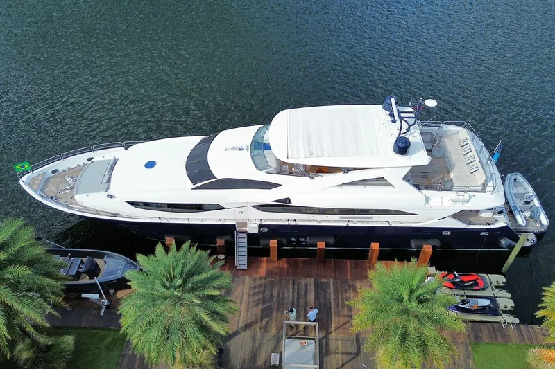 Blue Yacht Photos Pics Aerial view of 2011 Azimut 112 yacht docked by palm trees.