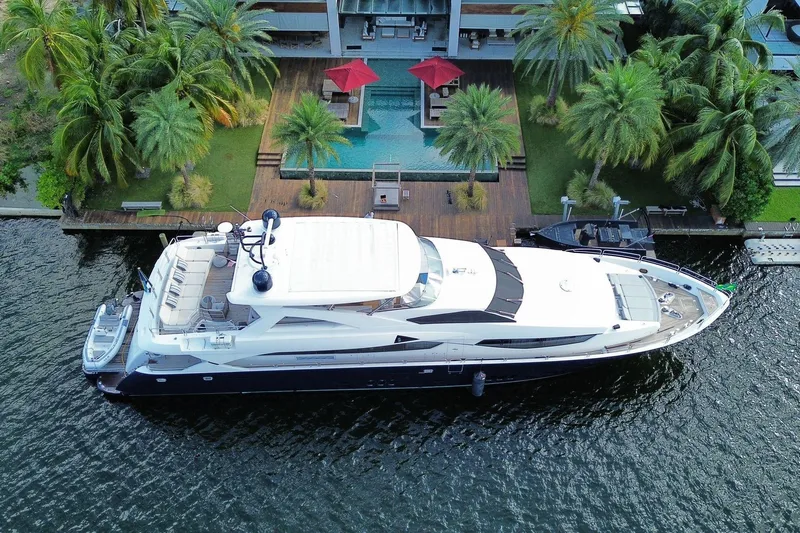 Blue Yacht Photos Pics Luxurious 2011 Azimut 112 yacht docked near tropical villa with pool and palm trees.
