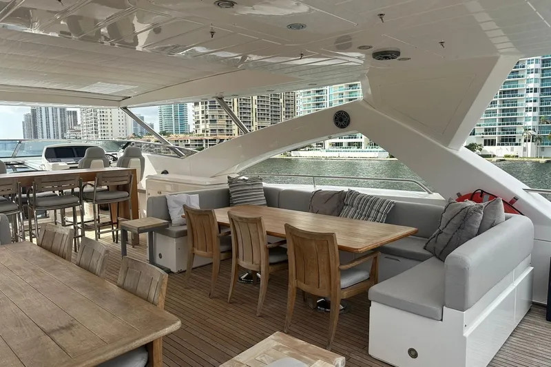 Blue Yacht Photos Pics Luxurious 2011 Azimut 112 yacht deck with elegant seating and dining area.