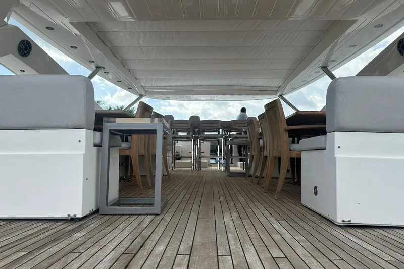 Blue Yacht Photos Pics Luxurious 2011 Azimut 112 yacht deck with elegant seating and wooden flooring.