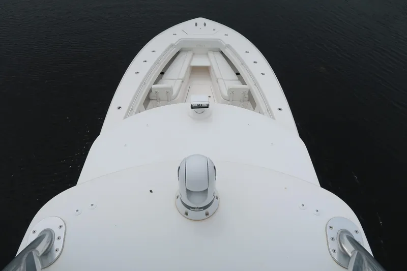 Bad Habit Yacht Photos Pics 2016 Invincible 42 Open Fisherman boat bow view on water.