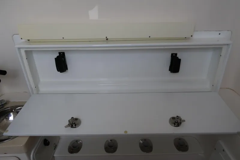 Bad Habit Yacht Photos Pics 2016 Invincible 42 Open Fisherman storage compartment with rod holders.