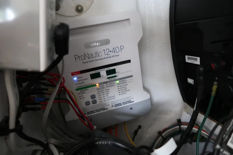 Bad Habit Yacht Photos Pics Battery charger and wiring inside a 2016 Invincible 42 Open Fisherman boat.