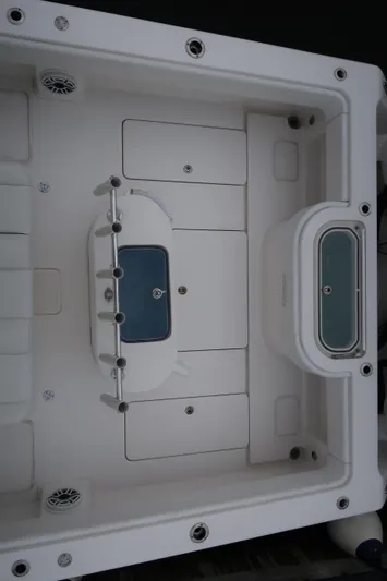 Bad Habit Yacht Photos Pics 2016 Invincible 42 Open Fisherman boat deck with storage compartments and livewell.