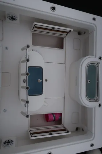 Bad Habit Yacht Photos Pics 2016 Invincible 42 Open Fisherman boat interior with storage compartments and rod holders.