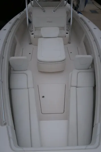 Bad Habit Yacht Photos Pics 2016 Invincible 42 Open Fisherman boat interior with white seating and storage.