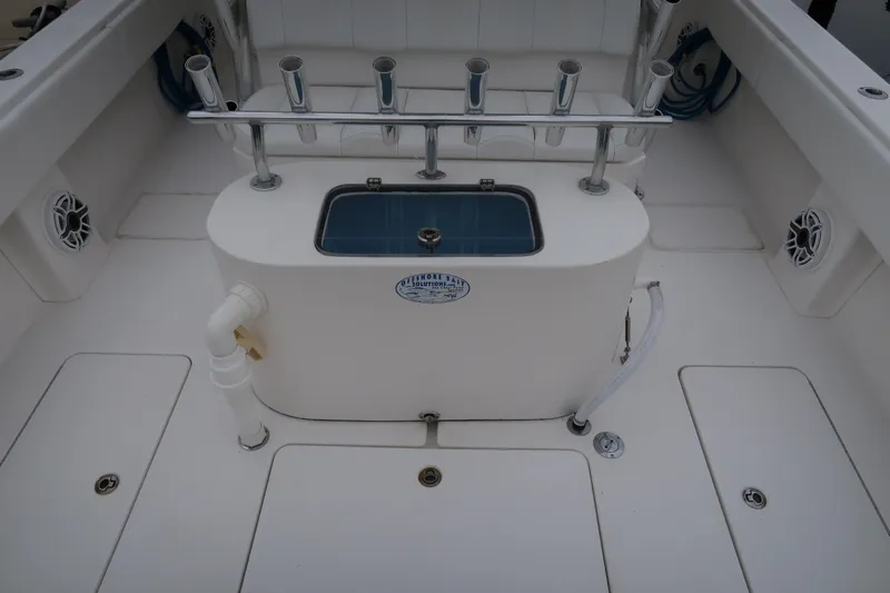 Bad Habit Yacht Photos Pics 2016 Invincible 42 Open Fisherman boat deck with rod holders and livewell.