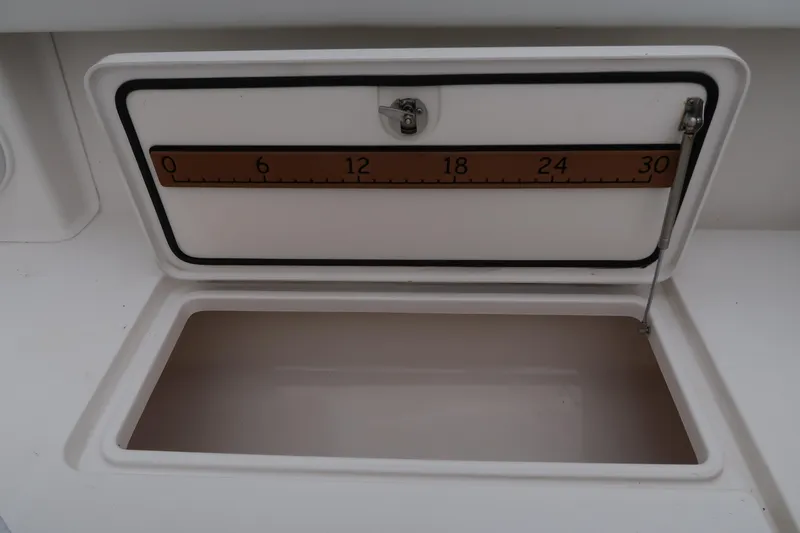 Bad Habit Yacht Photos Pics Open storage compartment with measuring scale on a 2016 Invincible 42 Open Fisherman boat.