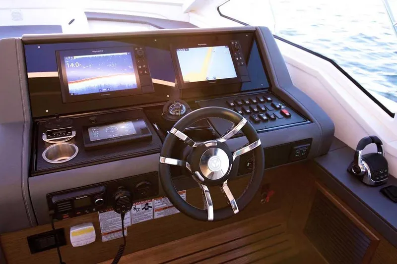 Sargam Yacht Photos Pics Helm of 2023 Cruisers 42 Cantius yacht with modern navigation displays and controls.