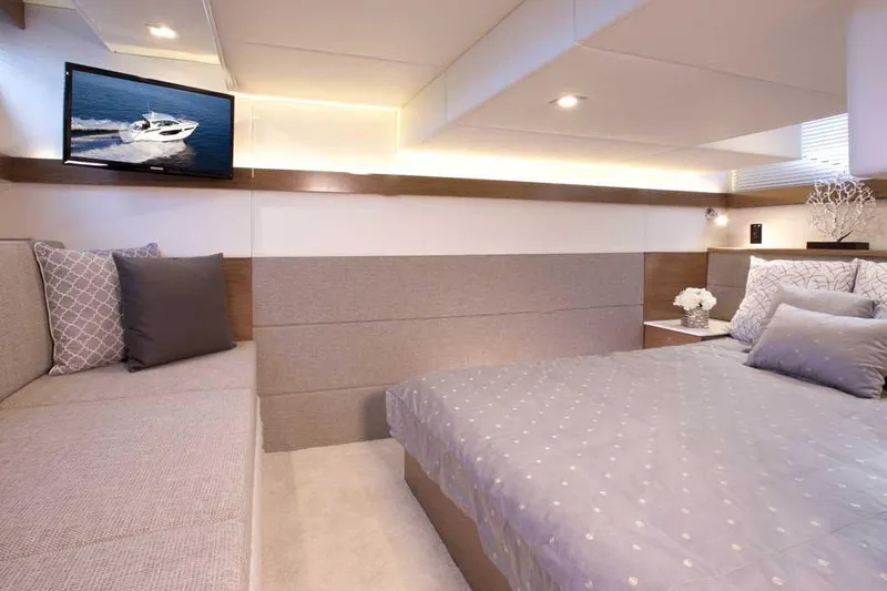 Sargam Yacht Photos Pics Luxurious interior of 2023 Cruisers 42 Cantius yacht with elegant bedroom and modern decor.