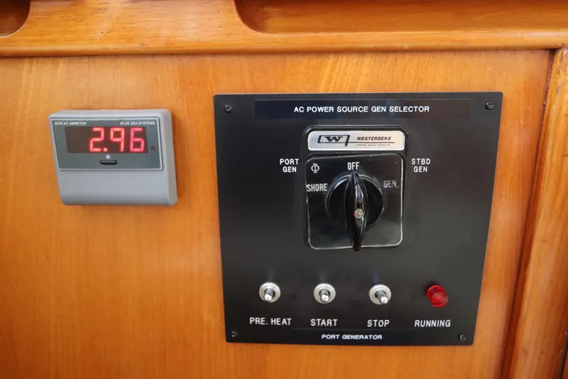 Sea Cow Yacht Photos Pics Control panel of a 2005 DeFever 49 Cockpit Motor Yacht with ammeter and generator selector.