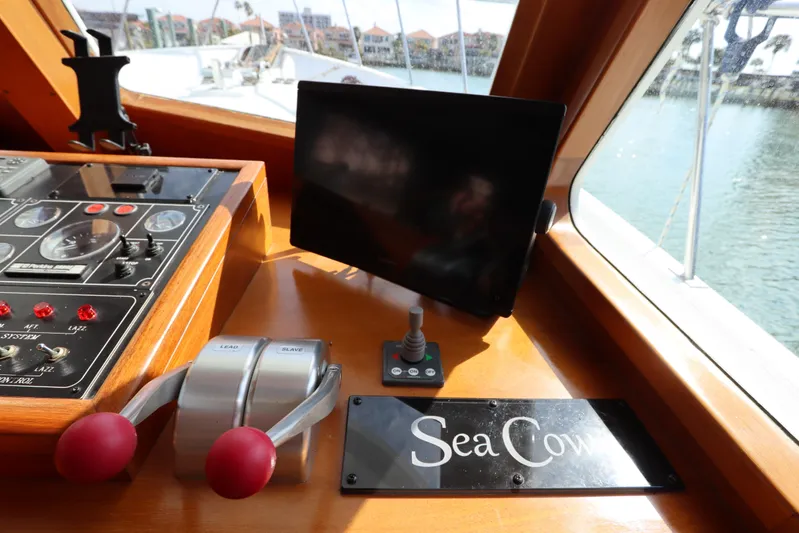 Sea Cow Yacht Photos Pics Control panel of 2005 DeFever 49 Cockpit Motor Yacht with "Sea Cow" nameplate.
