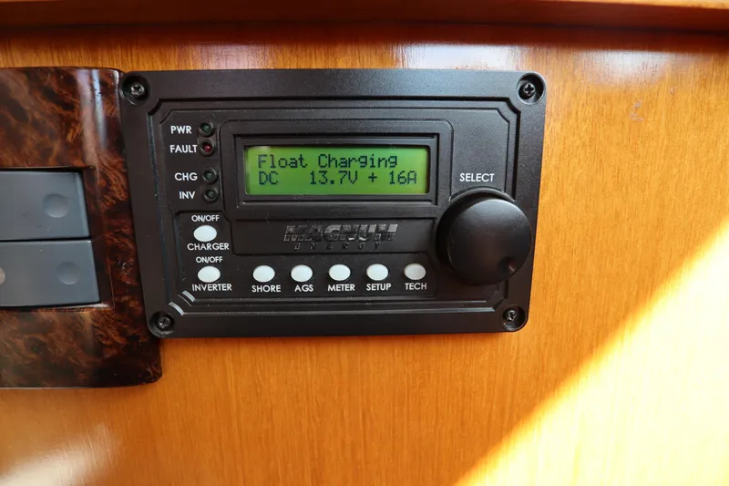 Sea Cow Yacht Photos Pics Control panel on 2005 DeFever 49 Cockpit Motor Yacht displaying float charging status.