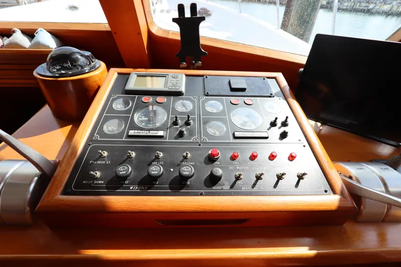 Sea Cow Yacht Photos Pics Control panel of a 2005 DeFever 49 Cockpit Motor Yacht, featuring navigation instruments.