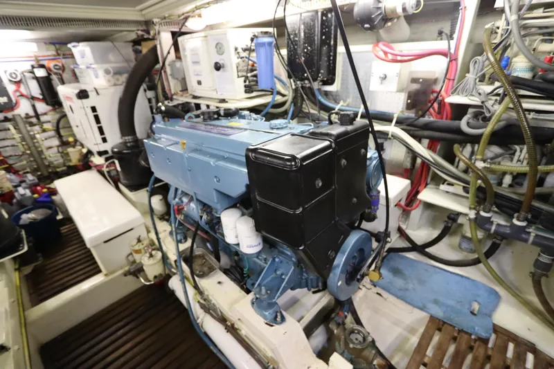 Sea Cow Yacht Photos Pics Engine room of 2005 DeFever 49 Cockpit Motor Yacht, showcasing mechanical components.