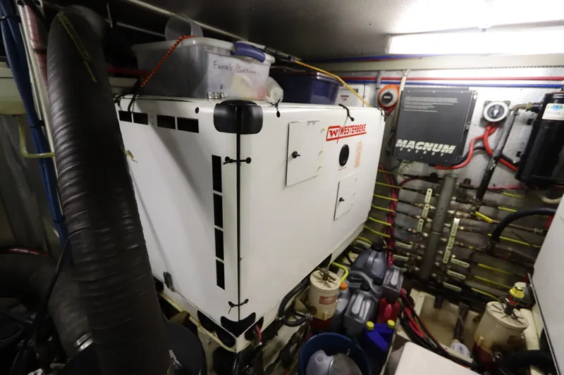 Sea Cow Yacht Photos Pics Engine room of 2005 DeFever 49 Cockpit Motor Yacht with Westerbeke generator.