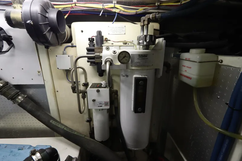 Sea Cow Yacht Photos Pics Engine room of 2005 DeFever 49 Cockpit Motor Yacht with mechanical components.