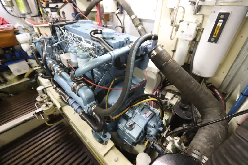 Sea Cow Yacht Photos Pics Engine room of 2005 DeFever 49 Cockpit Motor Yacht, showcasing complex machinery and components.