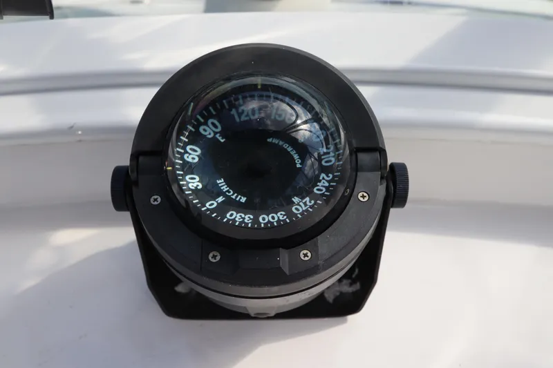 Sea Cow Yacht Photos Pics Compass on 2005 DeFever 49 Cockpit Motor Yacht, displaying navigational directions.