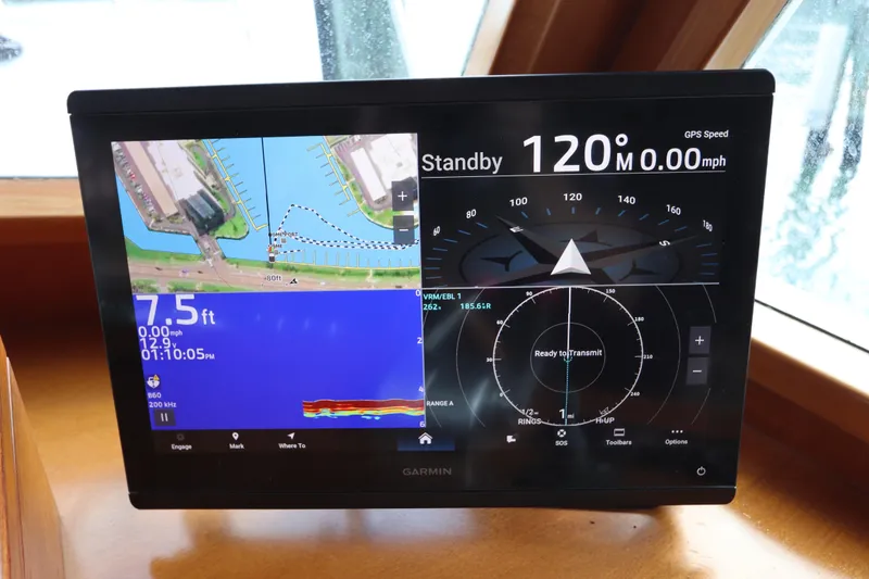 Sea Cow Yacht Photos Pics Garmin navigation display on 2005 DeFever 49 Cockpit Motor Yacht, showing map and compass.